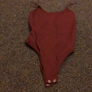 Burnt orange/reddish/brown solid colored bodysuit